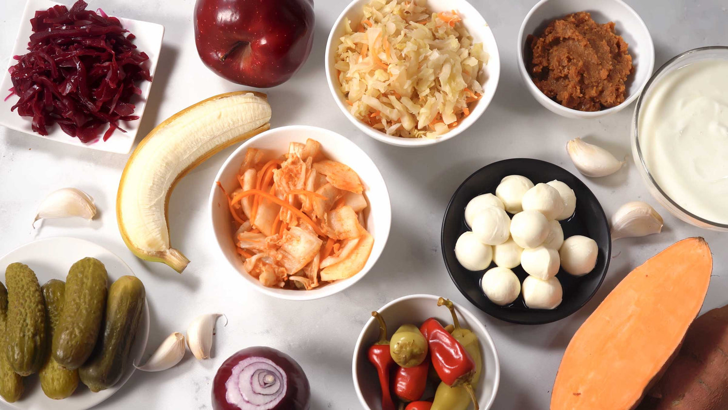 Prebiotics vs Probiotics Probiotic and prebiotic such as pickles, sauerkraut, kimchi, miso, fruits good for gut and overall health