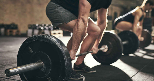 man doing deadlift training in gym