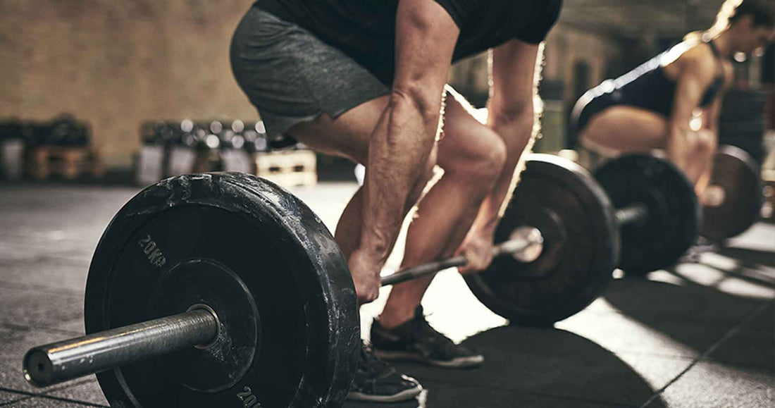 man doing deadlift training in gym