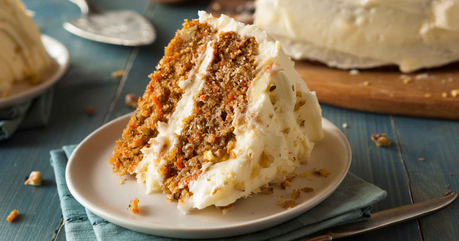 Skyr Carrot Cake Slice of carrot cake with frosting on a plate