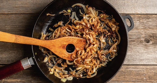 Pan of caramelized onions with spatula