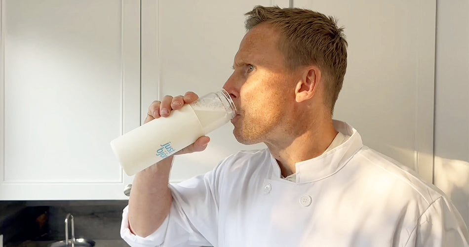 Bjorn Skulason side profile drinking a bottle of Just Bjorn marine collagen water