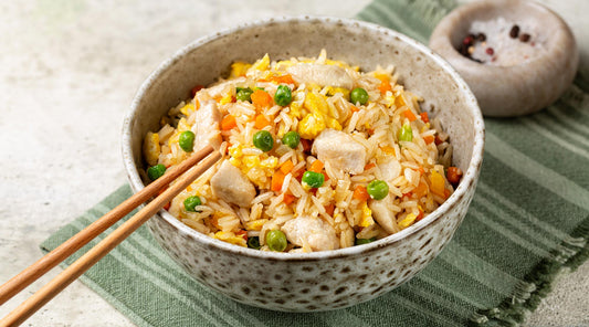 Bowl Chicken Fried Rice with chopsticks | Craving takeout? Try this easy, homemade Chicken Fried Rice recipe—quick, flavor-packed, and better than your favorite restaurant’s. Perfect for busy weeknights! | Just Björn Collagen