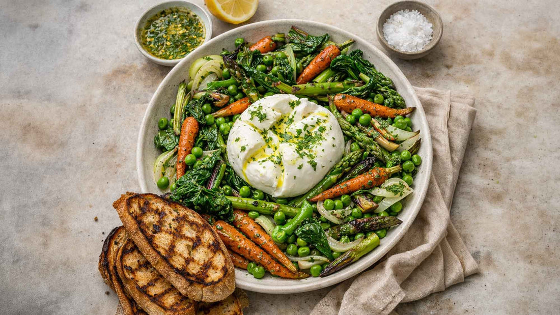 Spring vegetable platter with roasted carrots, asparagus, peas, Swiss chard, burrata, and lemon-herb dressing