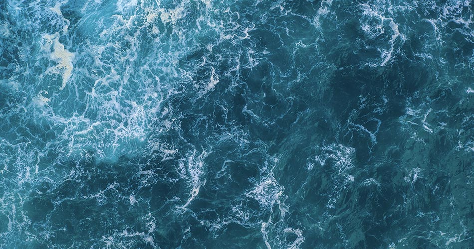 Close up photo of ocean waters from above.
