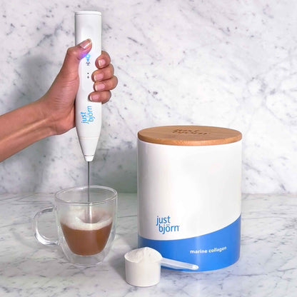 Just Bjorn whisk + frother blending marine collagen into espresso